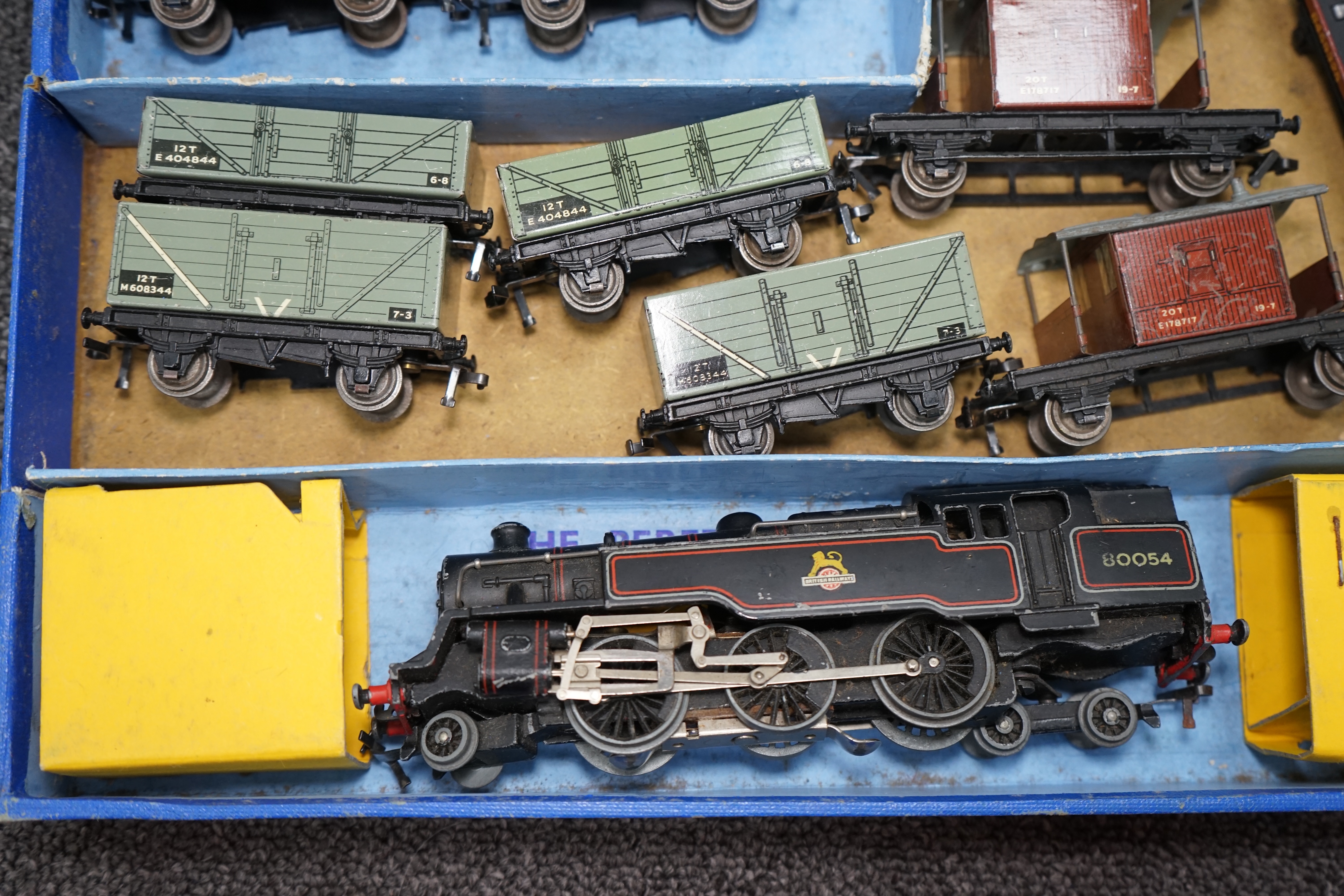 A collection of Hornby Dublo and Tri-ang Railways 00 gauge railway contained within two original boxes; a Hornby Dublo EDG17 Tank Goods Train B.R. set, contents include a BR Standard Class 4, 80054, fourteen tinplate fre